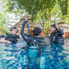 open-water-diver-course-in-pool-coral-grand-divers-descending-underwater-practice